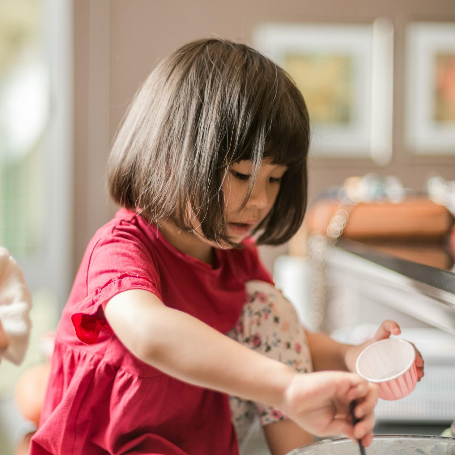 Community members collaborating in a modern kitchen space, sharing recipes and cooking techniques